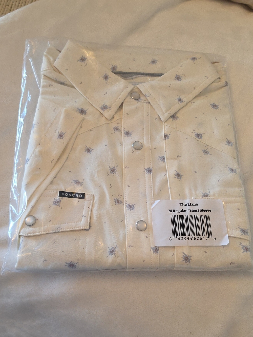The Llano Short-Sleeve Button-Down Shirt by Poncho — Cream with Blue Print